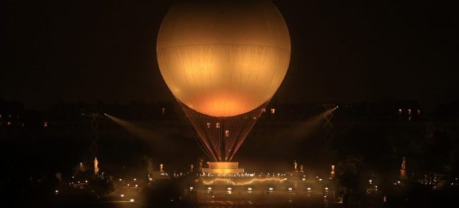 Olympic Cauldron floats in Paris night sky, Celine Dion performs