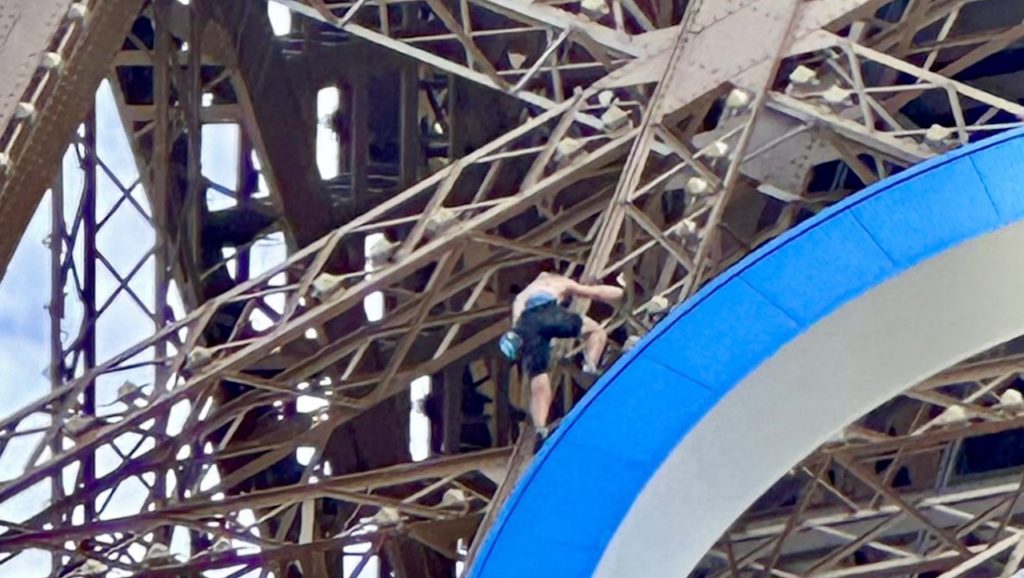 Watch: Man arrested for climbing Eiffel Tower before closing ceremony